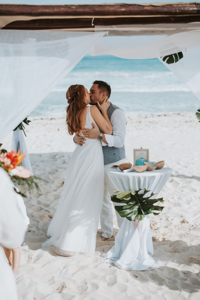 Half up bridal hairstyle in the Riviera Maya by Sarah Garnier Hair & Makeup artists.