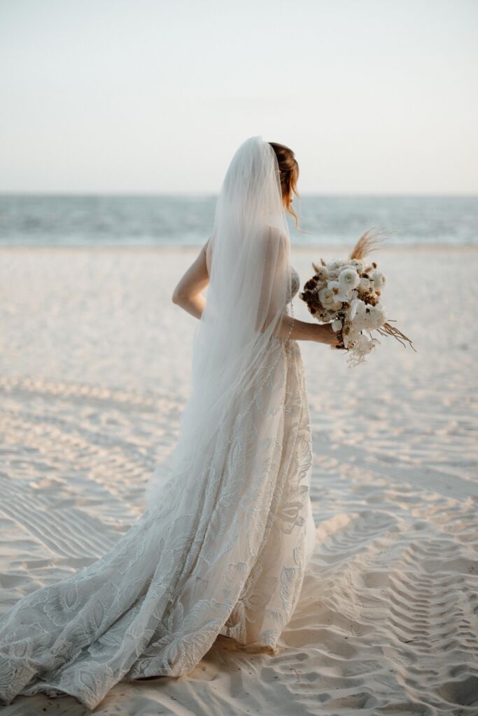 Bridal hairstyle with veil at Chable Maroma Wedding by Sarah Garnier & Co.