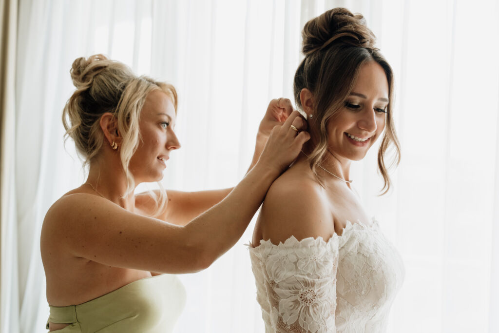 Destination bride getting ready, high bun hairstyle by Sarah Garnier & company in Mexico.